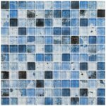 Blue glass mosaic tile with varied shades and textures, ideal for backsplashes and pool surfaces.