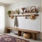 White textured herringbone tile with a matte finish, complemented by wooden accents and natural decor elements.