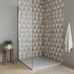 Decorative floral patterned ceramic tiles in neutral tones for shower wall.