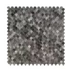 Close-up of peel and stick wall tile with a scalloped, mosaic design in shades of gray and black.