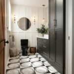 Black and white geometric patterned floor tiles with a matte finish in a modern bathroom.