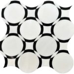 Bright white ceramic tile with bold black geometric patterns, smooth texture, and glossy finish.