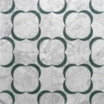 Marble tile featuring a white and gray marble background with a green crescent-shaped pattern. Elegant and modern design suit.