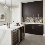 Bright modern kitchen with peel and stick tile backsplash, dark cabinetry, and marble countertop. Easy DIY wall tile upgrade.