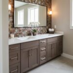 Modern bathroom vanity with peel and stick tile backsplash, double sinks, and a large mirror.