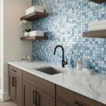 Modern kitchen with blue seashell tile backsplash, marble countertop, and wooden cabinets.