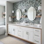 A stylish bathroom featuring a glass tile backsplash, double mirrors, and contemporary fixtures for a sleek, modern look.