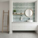 Glass tile backsplash with a modern design in a bathroom setting.