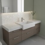 Bathroom vanity with shell tile backsplash and modern sink.