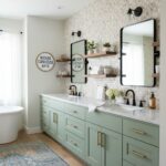 Bathroom featuring a glass tile backsplash, dual mirrors, and a light-colored vanity.