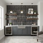 A sleek black glass tile backsplash enhances this contemporary kitchen design, paired with gray cabinetry and open wooden she.