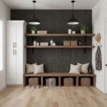 Bright entryway featuring dark textured tile wall, wooden shelves, and woven baskets for storage. Neutral tones create a warm.