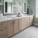Bathroom with peel and stick wall tile behind double sinks and large mirrors.