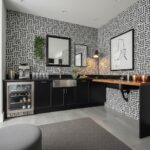 Black and white geometric patterned ceramic tile with a textured surface, used in a contemporary kitchen setting.