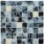 Up of a glass tile mosaic featuring shades of blue, black, and white with intricate veining and glossy finish.