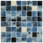 Blue glass tile mosaic with splattered and textured patterns, ideal for backsplashes and pool surfaces.