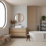 Bright, neutral-toned bathroom featuring textured beige tiles, wooden cabinetry, and a freestanding bathtub.