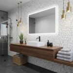Light-colored mosaic wall tile with textured surface and subtle pattern.