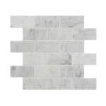 White marble brick tile with subtle gray veining, smooth texture, and polished finish.