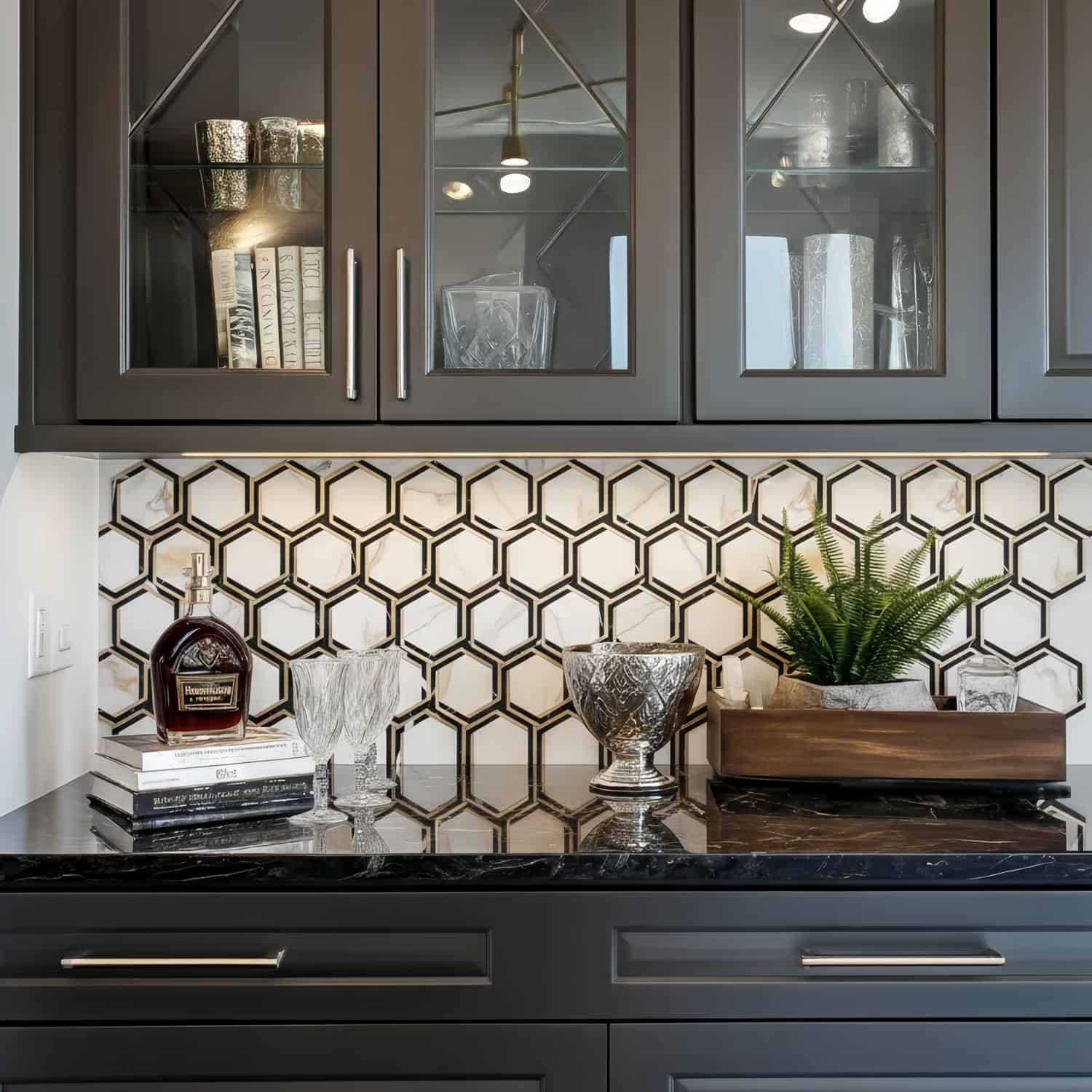 Kitchen with peel and stick wall tile featuring a honeycomb pattern and decorative glassware.
