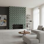 Green and white geometric patterned tile with a glossy finish, used as a decorative fireplace surround in a contemporary livi.