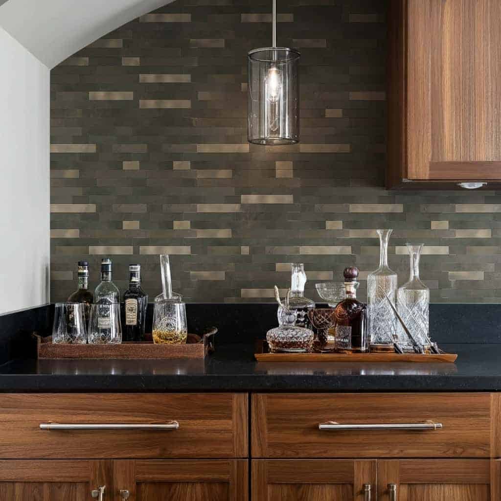 Modern kitchen backsplash with peel and stick wall tiles in a dark, textured pattern.