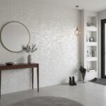 Seashell tile wall with mother of pearl finish in a contemporary home interior, creating a luminous and elegant accent wall.