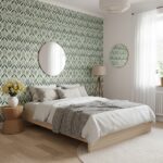 Bright bedroom with green leaf patterned wallpaper, round mirrors, and cozy bedding. Natural light enhances the fresh, calmin.