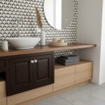 Patterned wall tiles in black and white, with a wooden vanity featuring a white vessel sink and mirror.