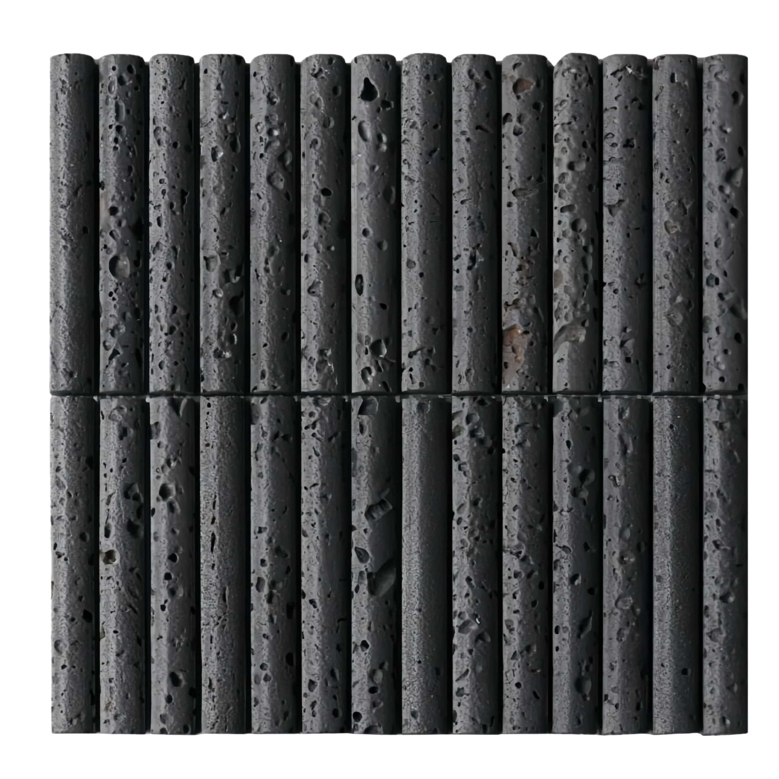 Dark gray textured volcanic stone tiles with porous surface, ideal for contemporary home decor.