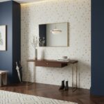 A stylish interior featuring a wall decorated with mother of pearl shell tiles, creating a shimmering, elegant look.
