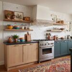 Modern kitchen with peel and stick tile backsplash, wooden cabinets, and open shelves displaying decor and kitchenware.