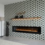 Geometric patterned tile wall with black, white, and gray colors, featuring a sleek fireplace and minimalist decor.