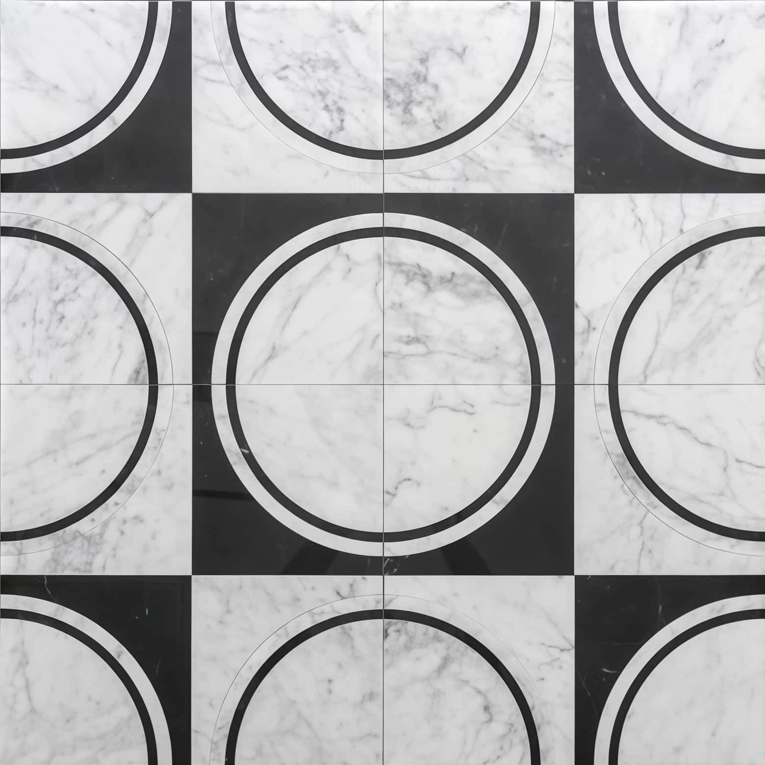White marble tile with black and white circular pattern.