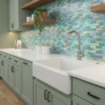 Beautiful glass tile backsplash behind the sink in a modern kitchen.