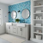 Bathroom with blue glass mosaic tile backsplash, double sinks, and modern decor.