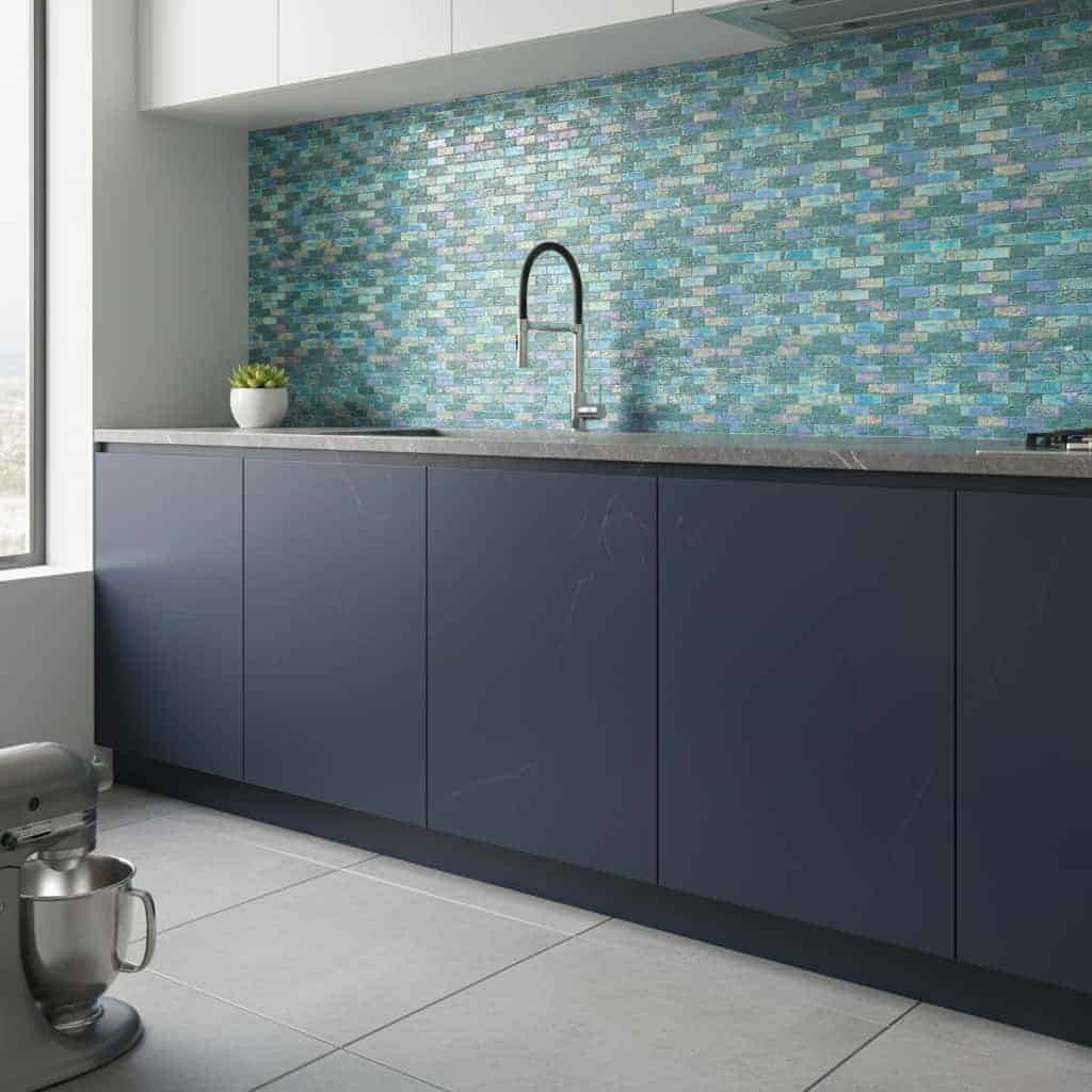 Glass tile backsplash with blue and green hues in contemporary kitchen design.