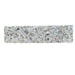 Light beige and cream terrazzo tile with multicolored stone fragments.