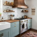 Bright kitchen featuring a glass tile backsplash and vintage-style cabinetry.