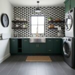 Bright kitchen featuring a geometric black and white tile backsplash, green cabinetry, and stainless steel appliances.
