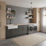 Modern laundry room with peel and stick wall tiles, cabinetry, and washer/dryer.