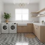 Bright laundry room with light wood cabinets, white walls, and a black-and-white geometric patterned floor tile. Features a l.