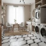 Bright laundry room with black and white geometric patterned tiles, white cabinetry, and natural light from large window.