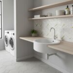 Mother of pearl shell tile decorates the laundry room wall behind the sink, adding a luxurious and natural touch to the space.