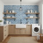 Bright laundry room featuring a blue glass mosaic tile backsplash, white farmhouse sink, and modern washing machine.