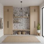 Beige wood cabinets with textured mosaic tile backsplash, neutral decor, and natural lighting.