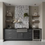 Gray kitchen backsplash tile with a textured, stone-like surface and a vertical pattern.