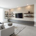 Modern living room featuring peel and stick wall tile behind TV and floating shelves, creating a stylish and easy-to-install.