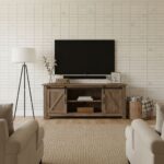 A modern living room featuring a white brick wall, a wooden TV console, and cozy seating. Perfect for contemporary home decor.