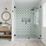 Bright white and gray geometric patterned shower tile with textured surface.